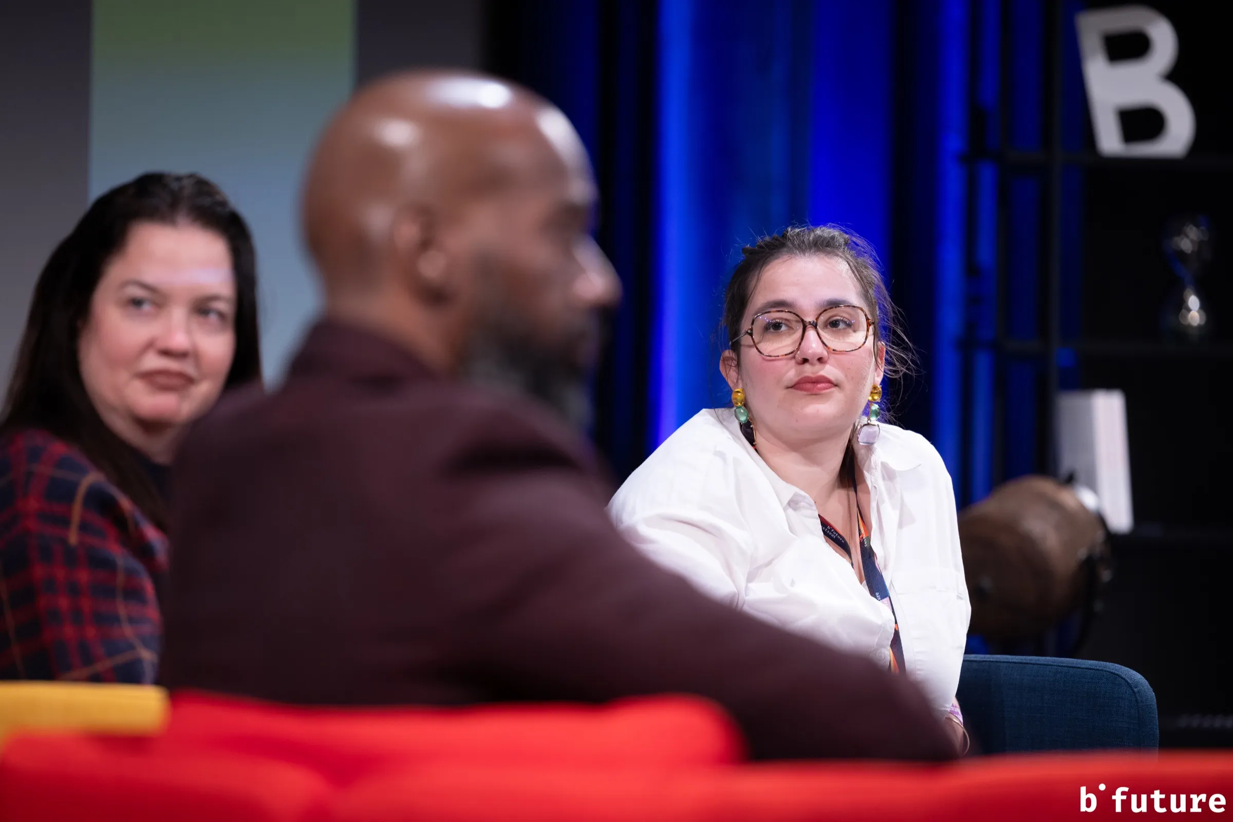 Méline Laffabry listening to a fellow speaker at the b° future festival